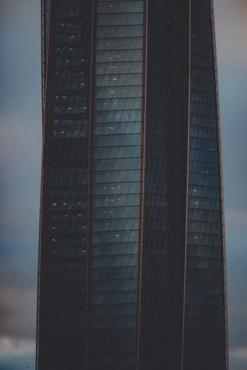 Modern Glass Skyscraper on Dark Sky