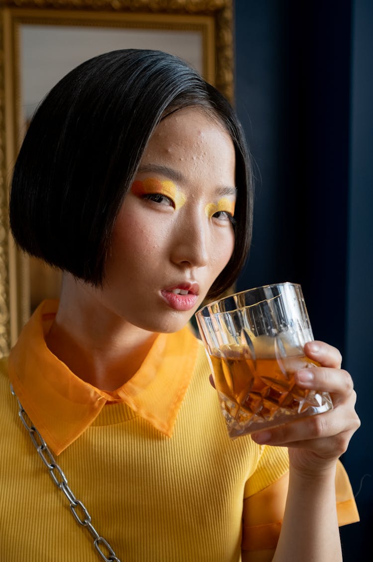 Woman Holding Whiskey Glass