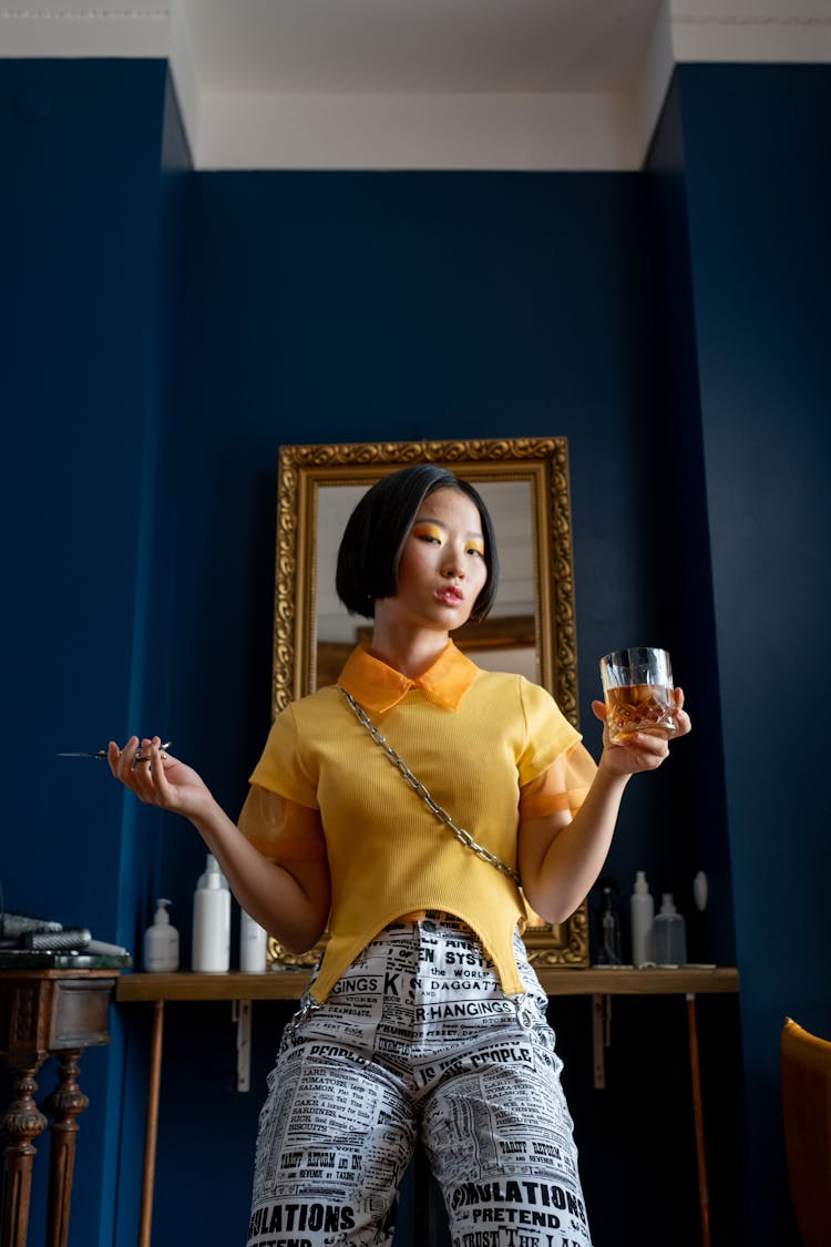 Hairdresser Posing Holding Scissors And Whiskey Glass