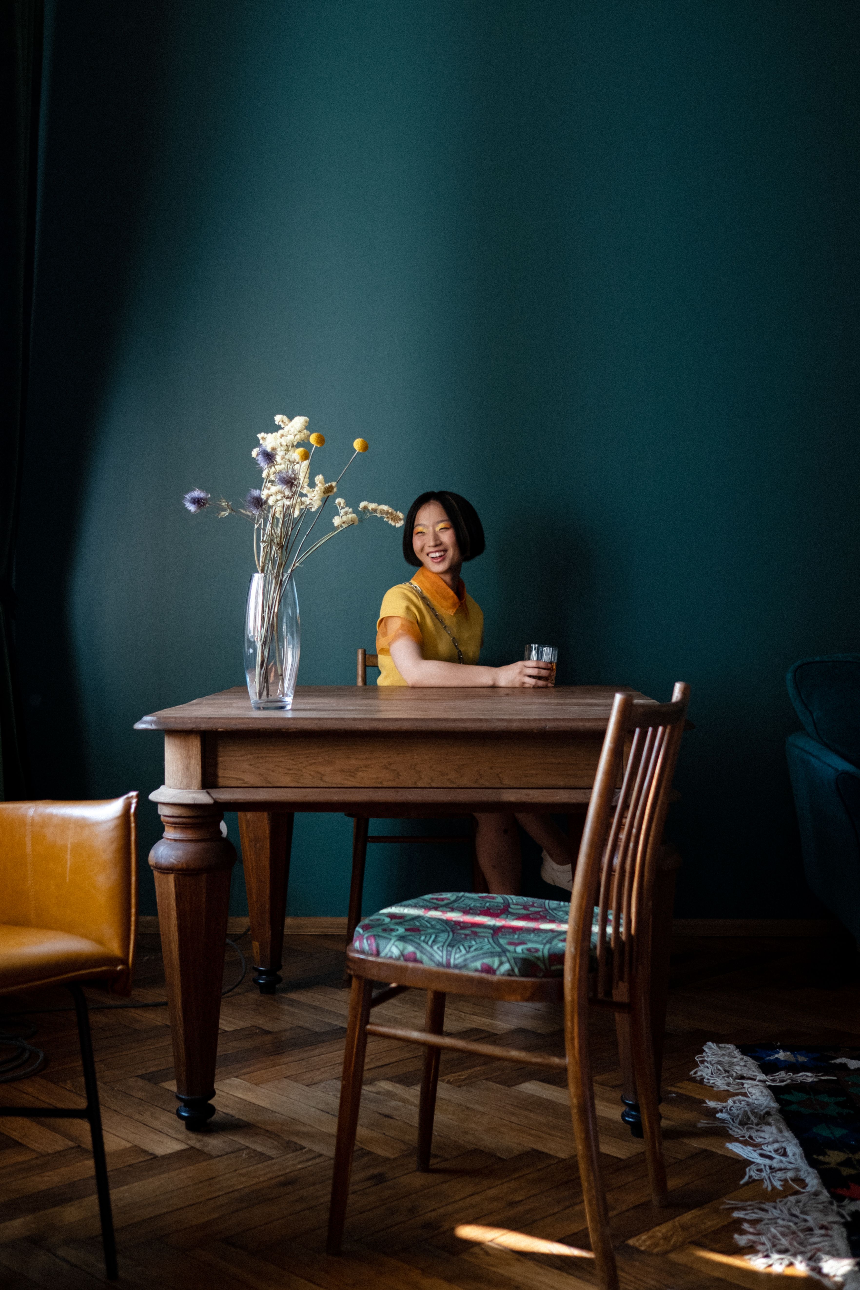 Smiling Woman behind Table · Free Stock Photo
