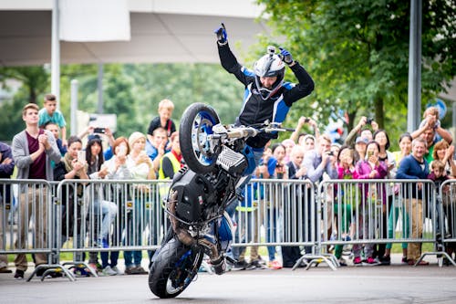 Man in Black Helmet Riding Motorcycle