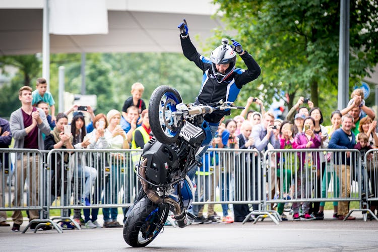 Man In Black Helmet Riding Motorcycle