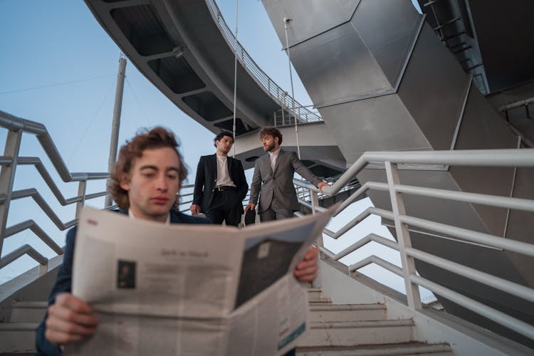 Men Hanging Out At A Staircase