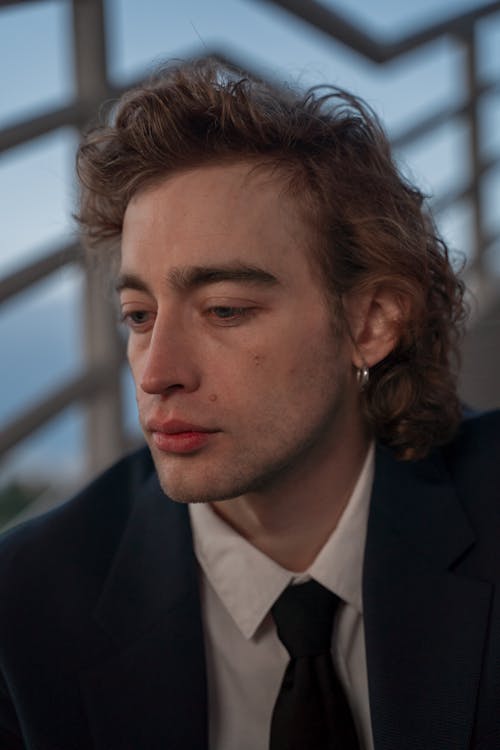 Portrait of a Handsome Man with Brown Curly Hair