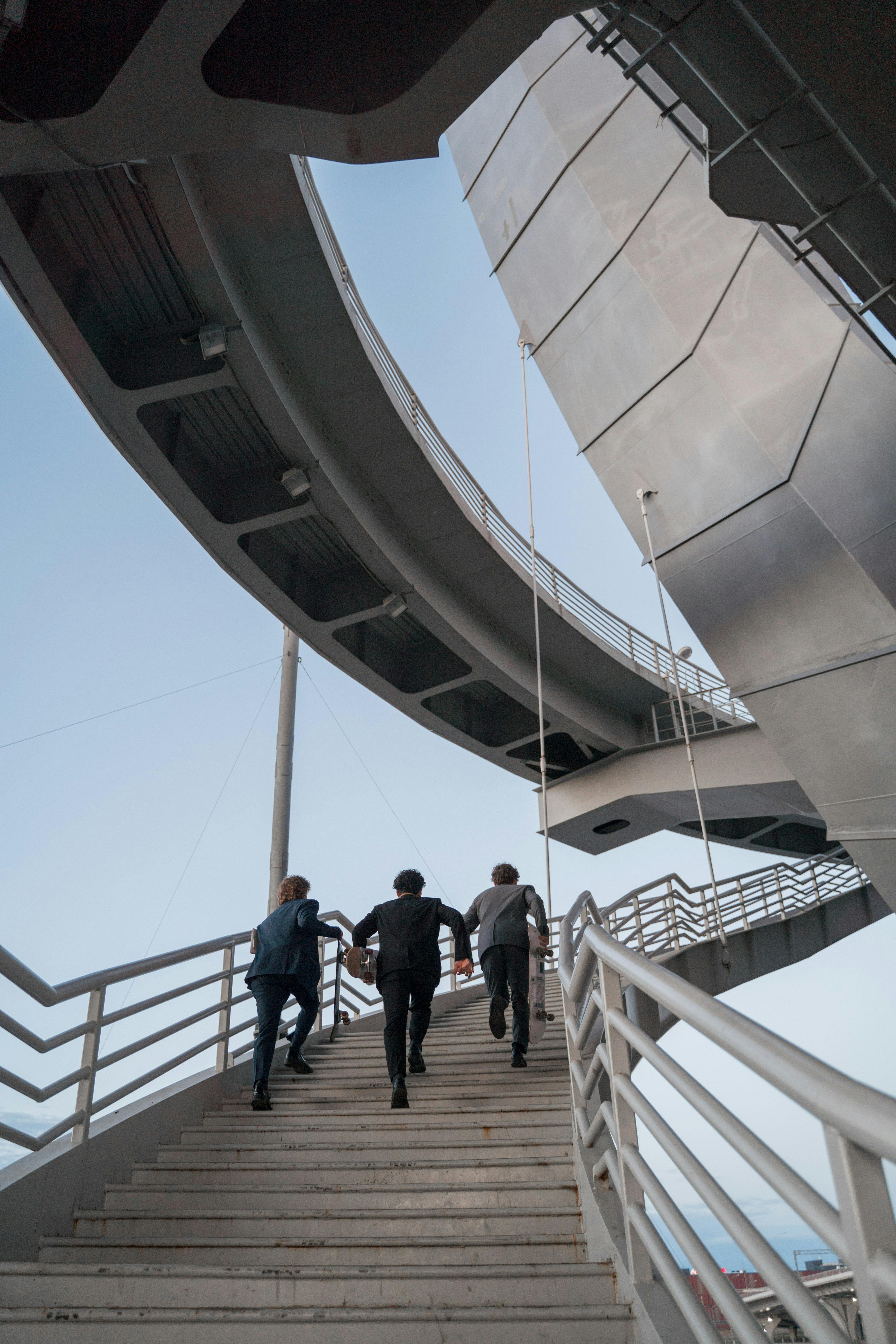 photo of men running up the stairs