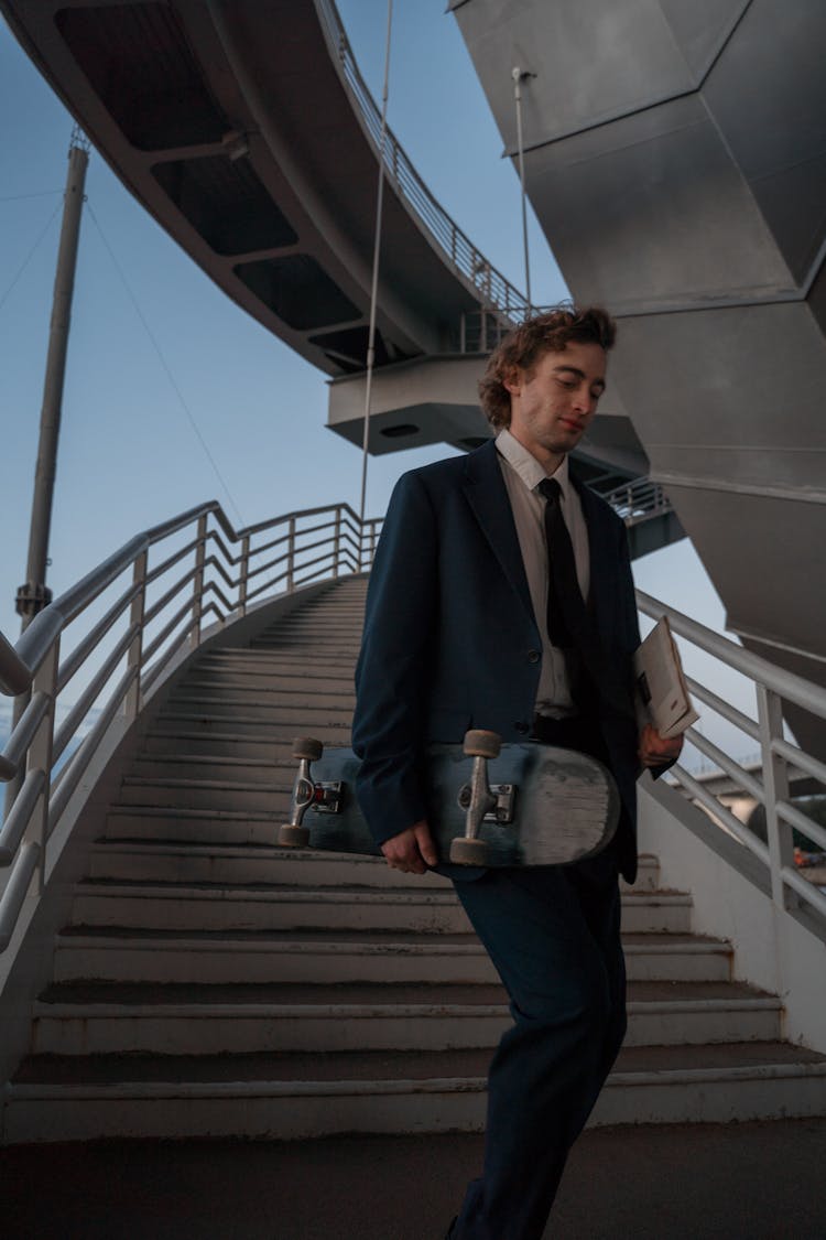 Man In Suit Walking Down The Stairs