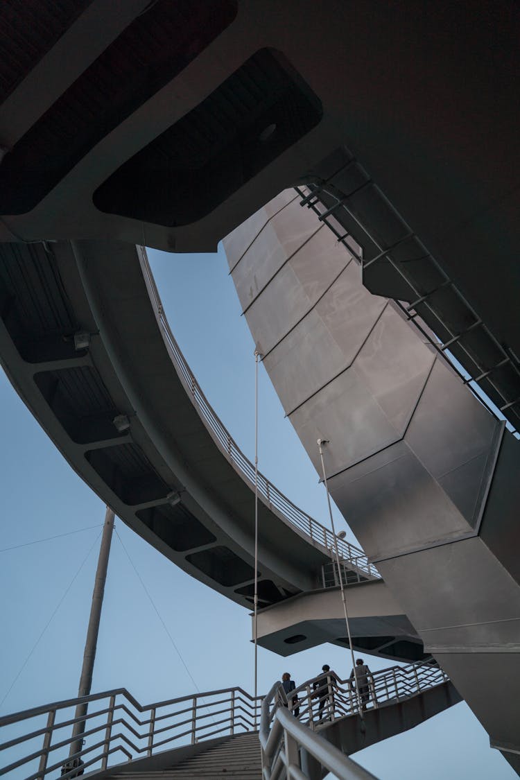 People Walking On Steps At A Contemporary Structure 