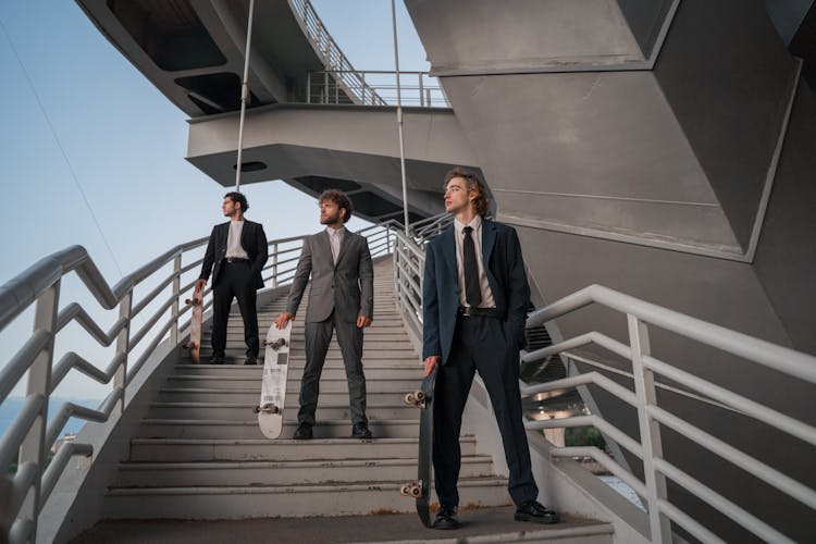 Group Of Men With Skateboards Posing Together