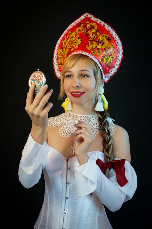 Woman with Braided Hair in Traditional Hat