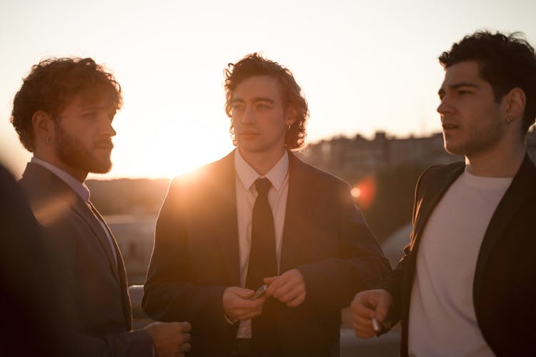 Group Of Men Smoking Cigarettes