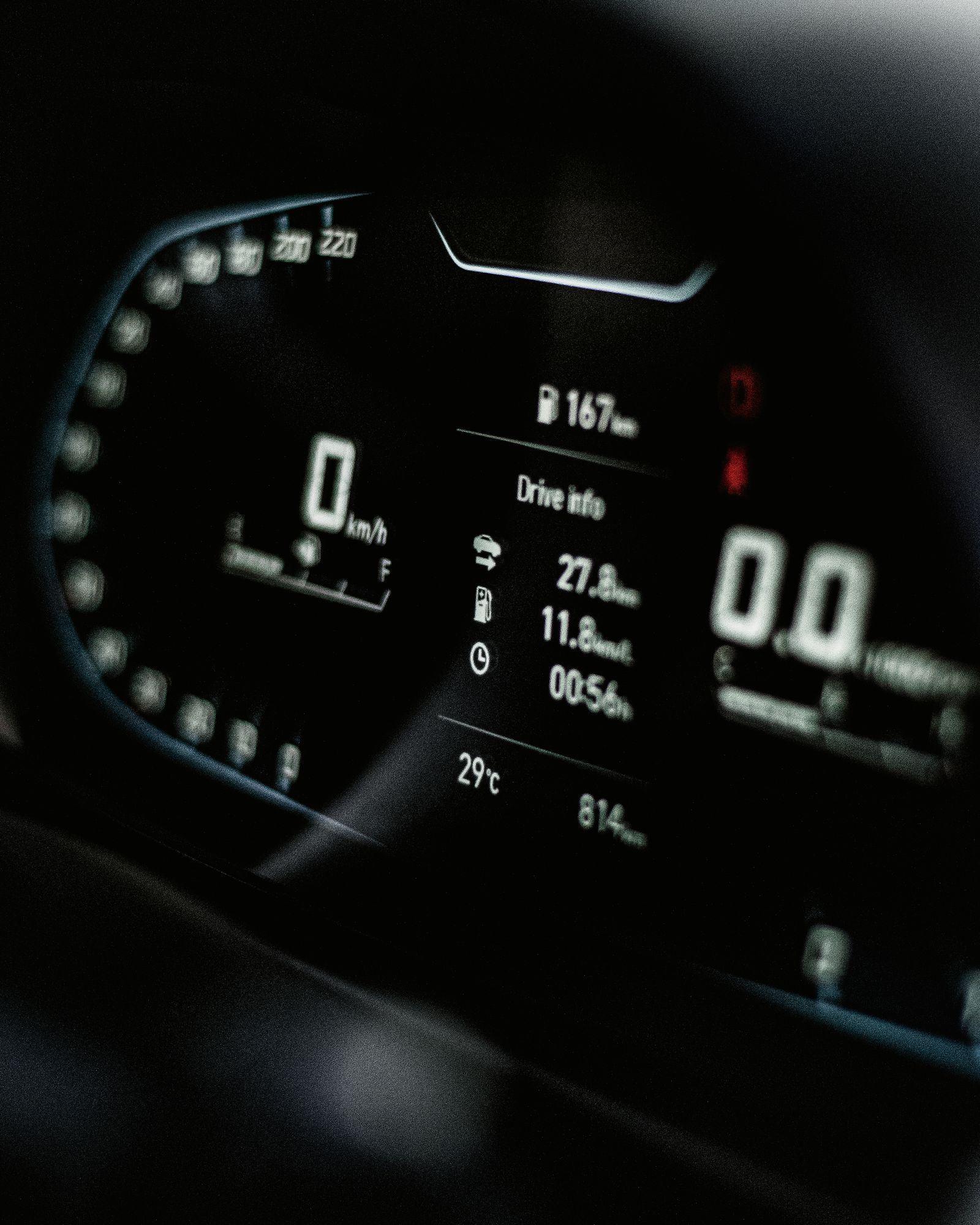 Close-up of a digital car speedometer dashboard display