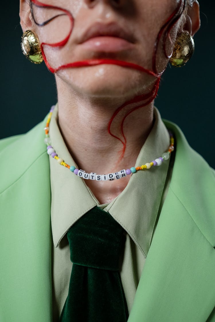 Androgynous Man With Outsider Necklace