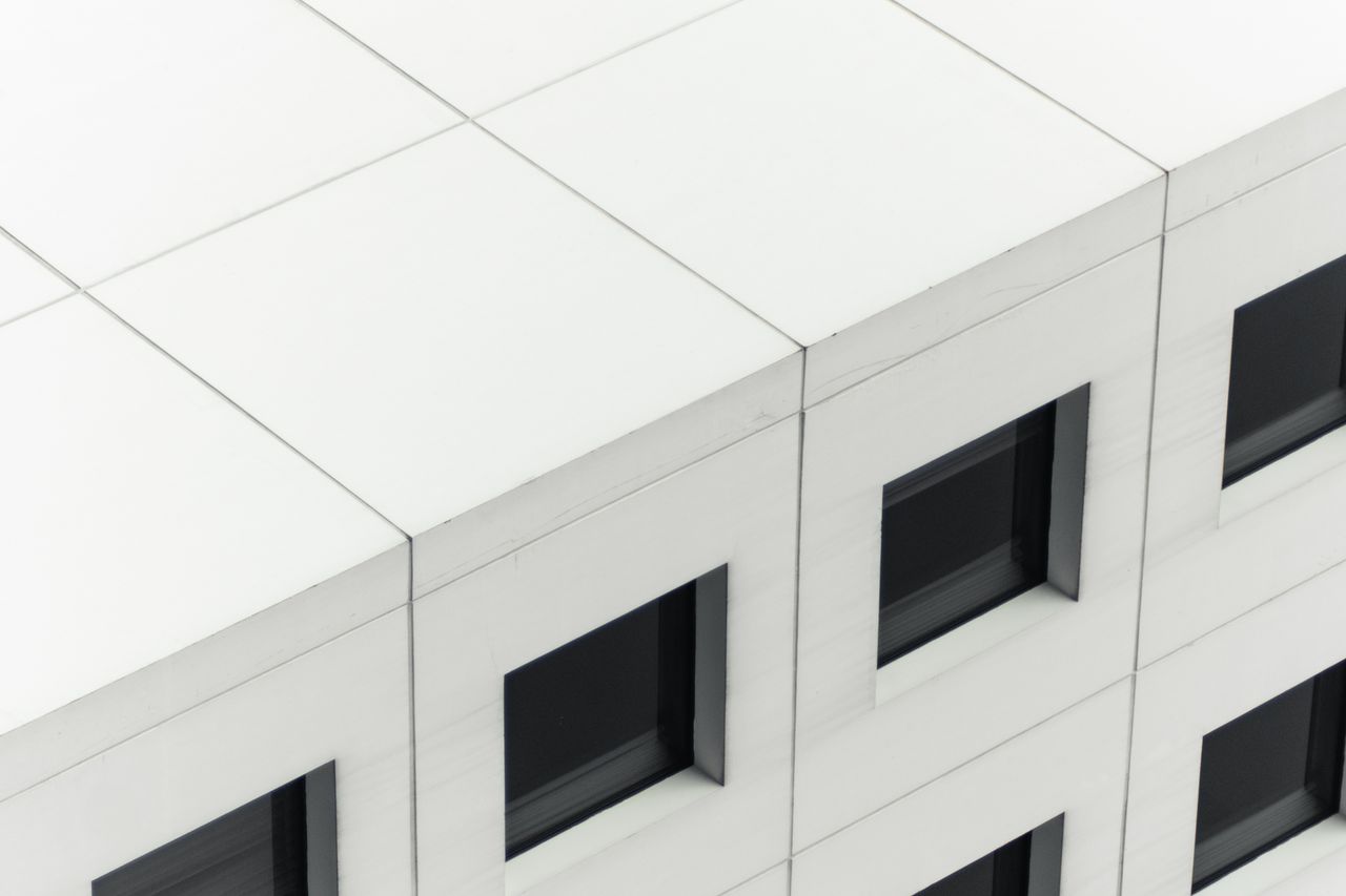 close up view of a modern building facade highlighting symmetrical win