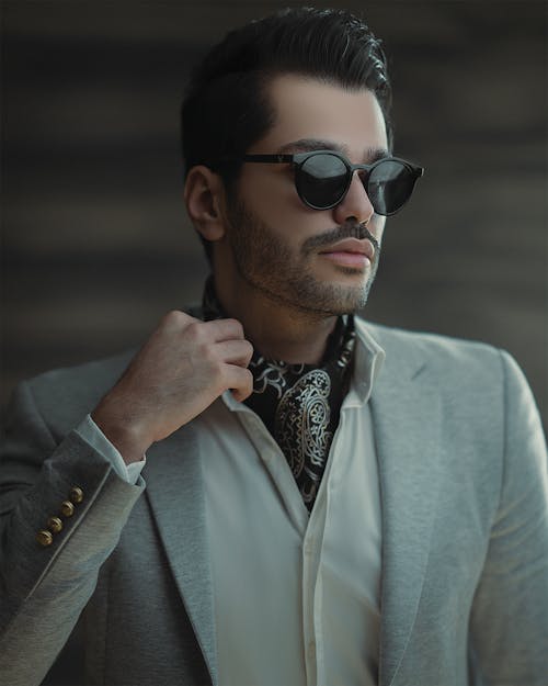 Portrait of Man in Suit Wearing Sunglasses