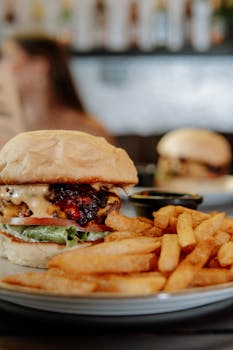 Delicious cheeseburger with fries, perfect for fast food lovers.