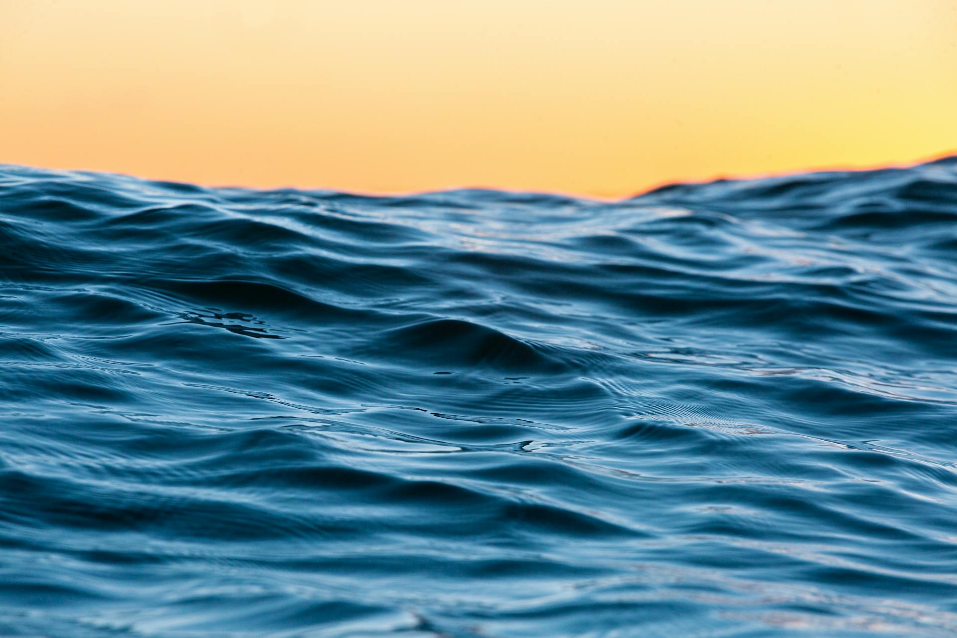 Sunset Over Sea Waves