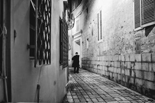 Grayscale Photo of Person Standing While Holding a Newspaper · Free ...