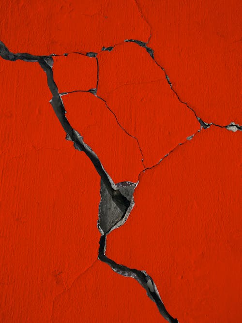 Red Painted Wall with Cracks