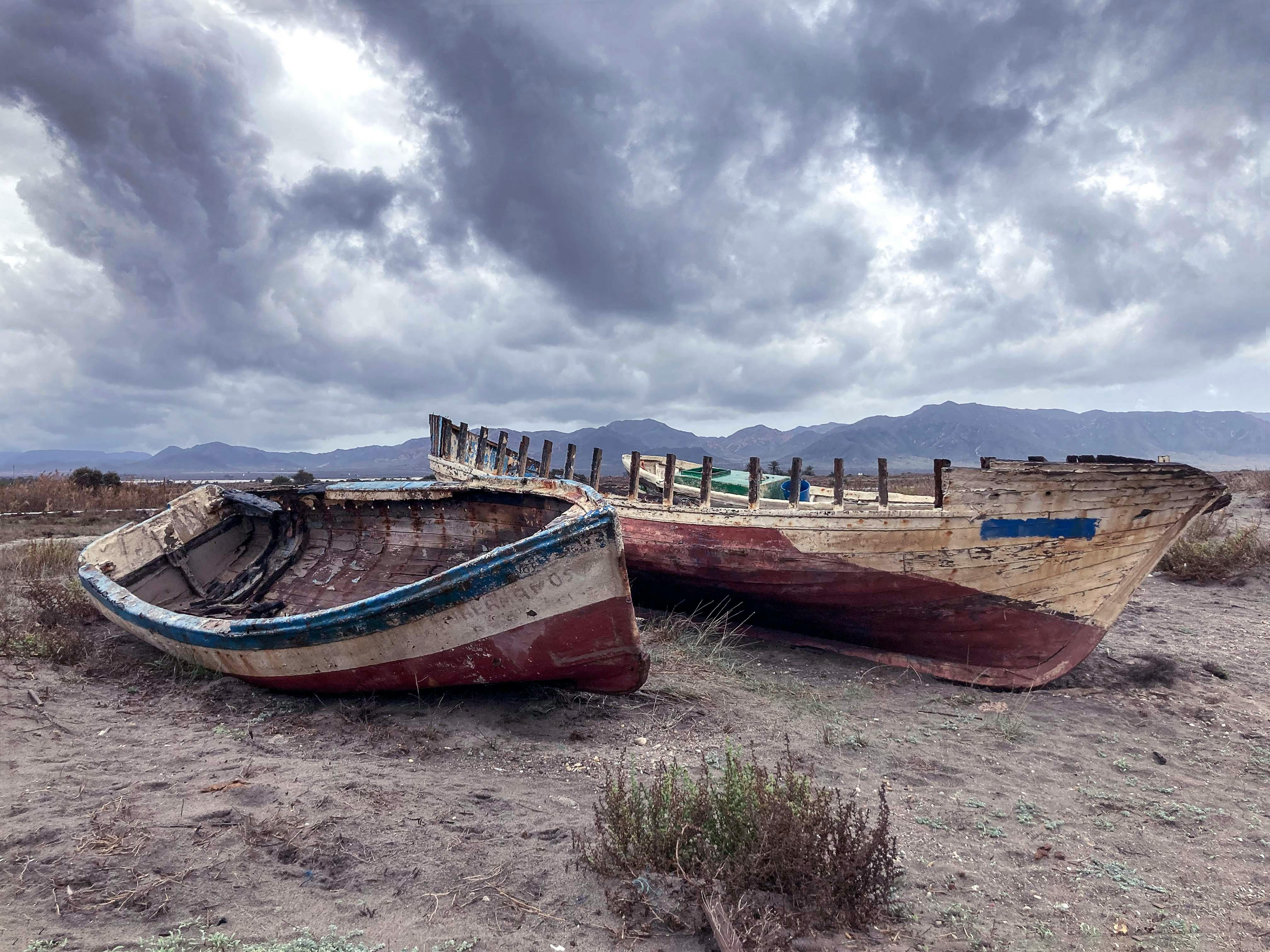 Premium Photo  Old wooden boat near the lake, used by local people for  fishing, boat in poor condition