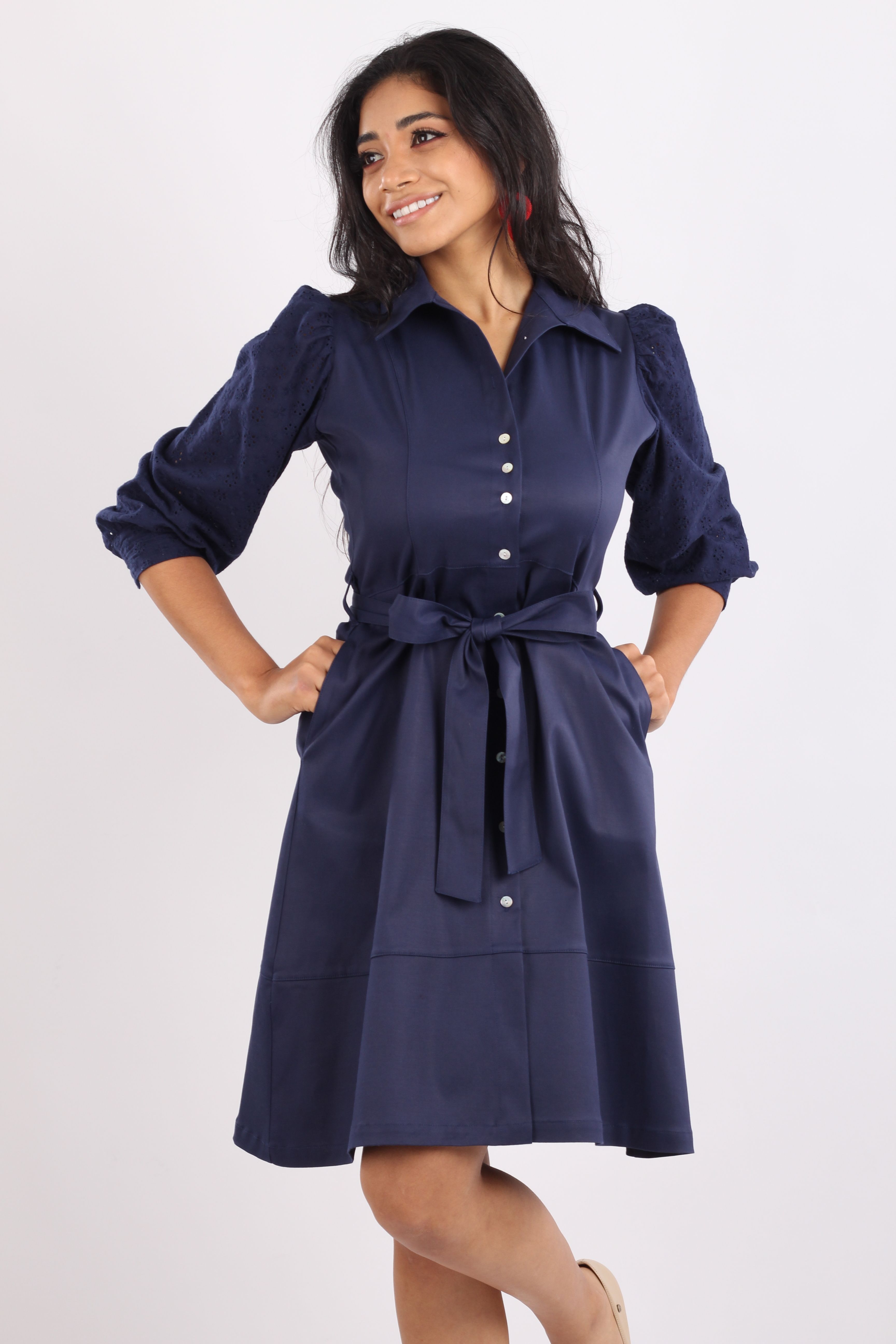 Woman in a navy fit-and-flare work dress