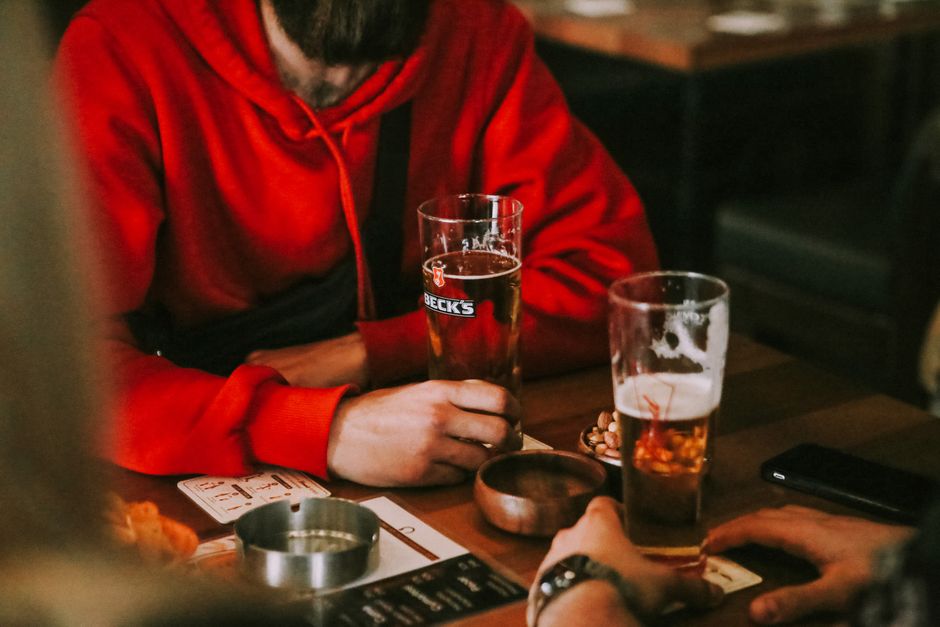 Pint of Zlatý Bažant beer and a glass of Kofola on a table in a Slovak pub