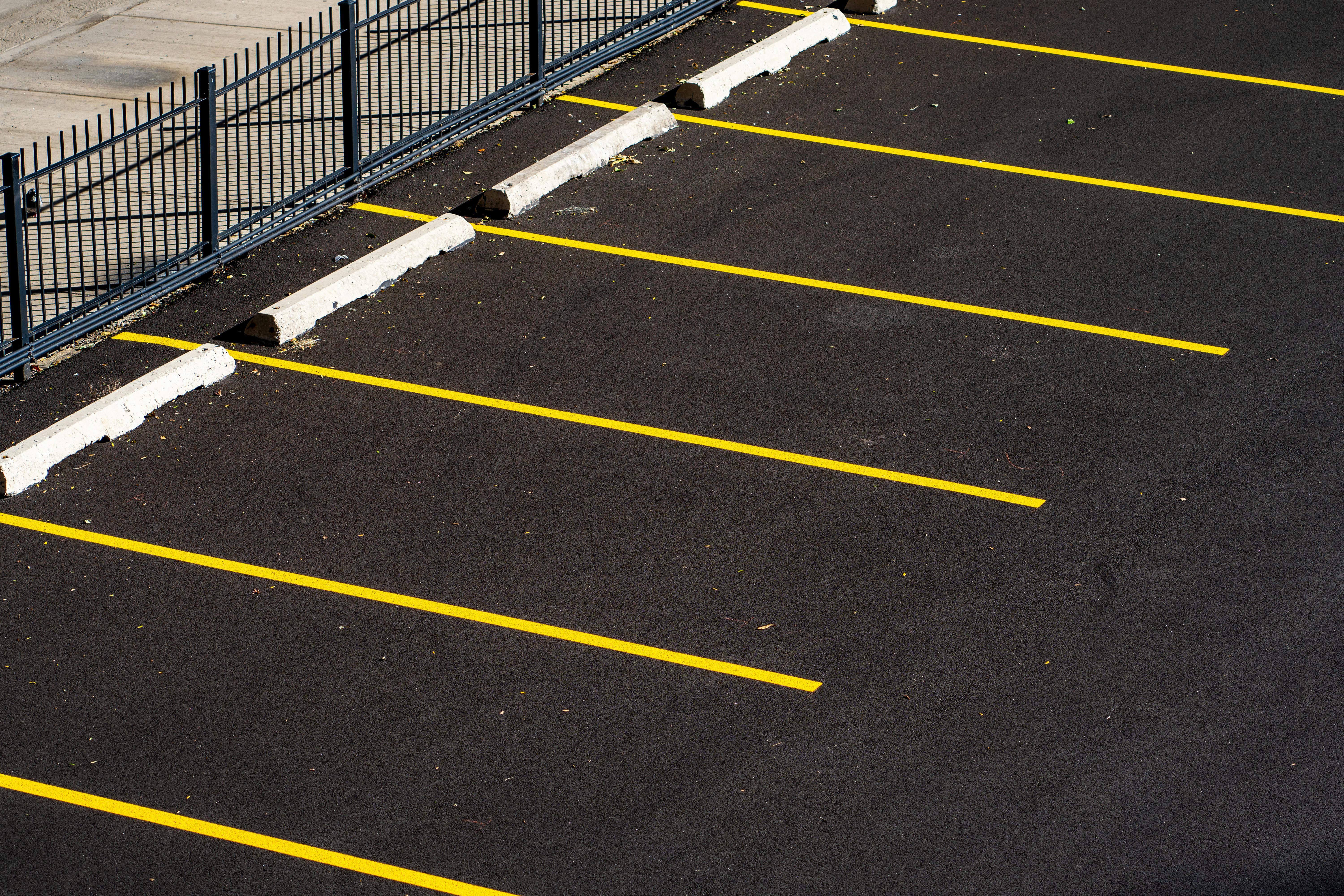 Yellow Lines on the Ground of Parking Lot · Free Stock Photo