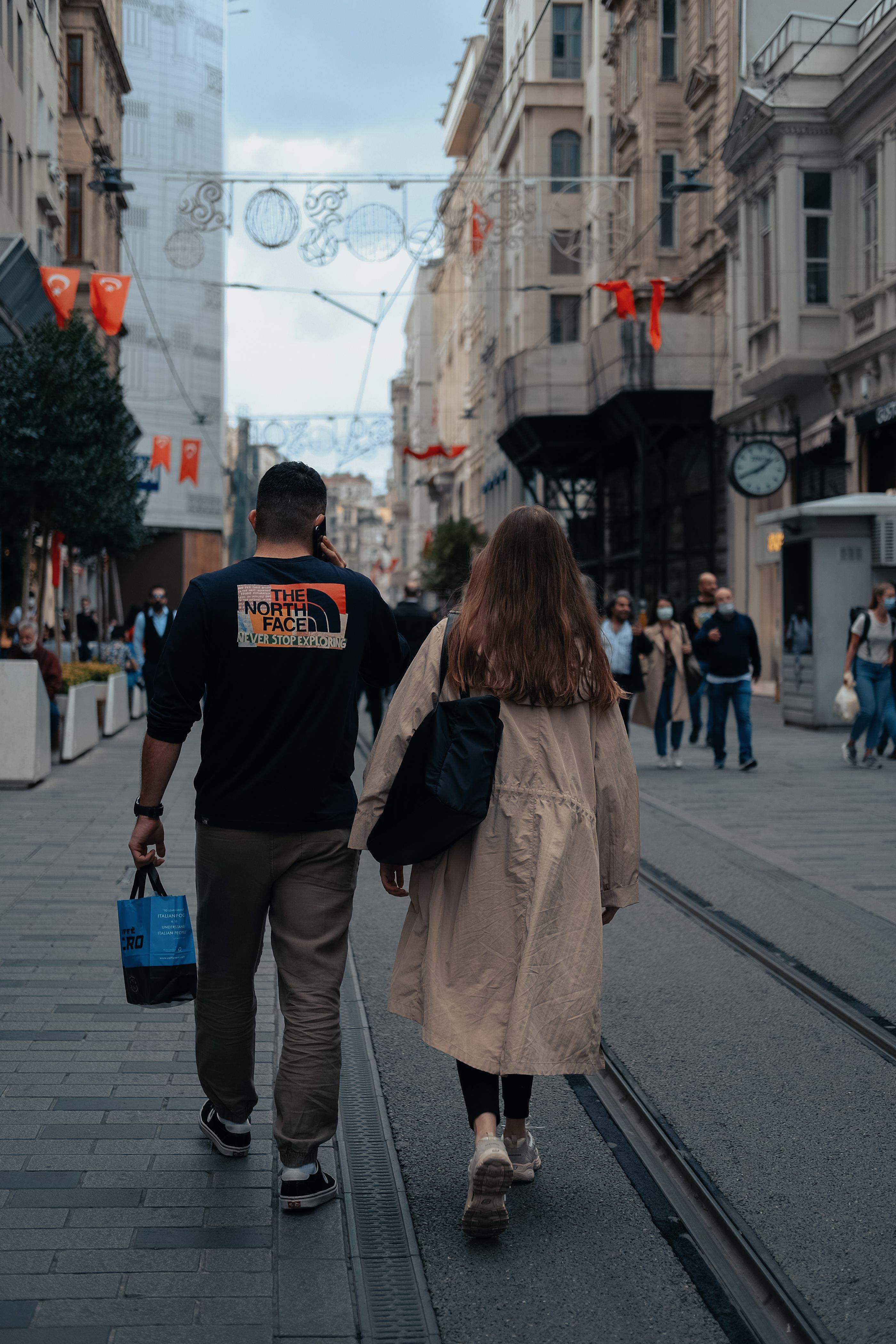 Photo of a Man and Women Walking Together · Free Stock Photo