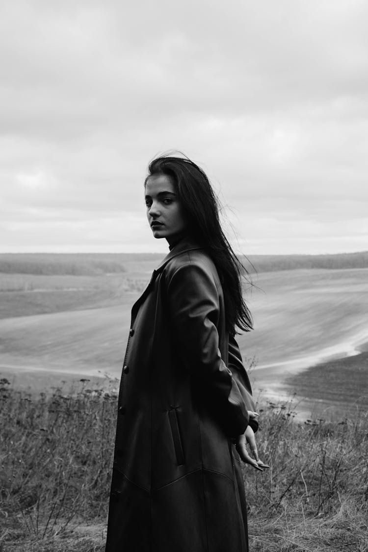 Woman In Leather Jacket Posing In Wild Nature