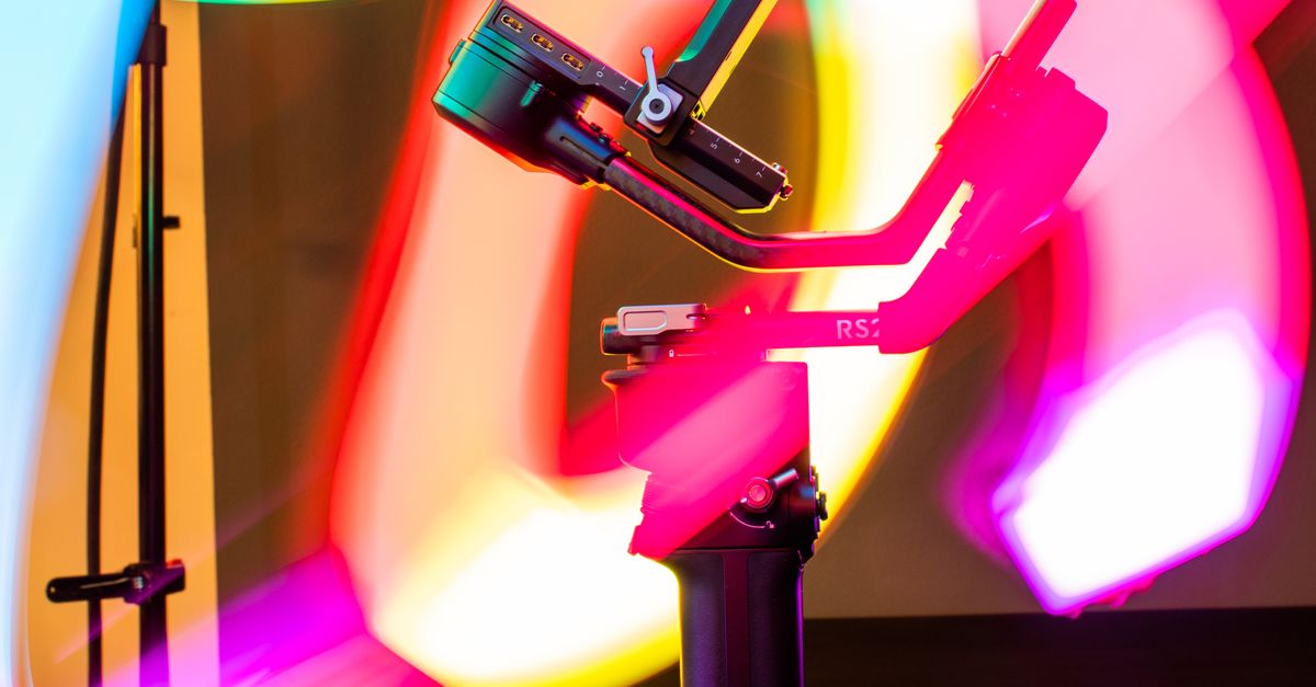 Digital Camera With String Camera Rig surrounded with Bright String Lights · Free Stock Photo