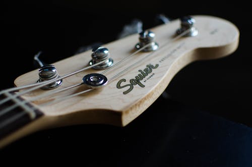 Brown Wooden Guitar Head in Close-Up Photography