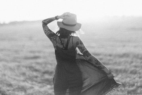 Grayscale Photo of a Woman with Tattoos