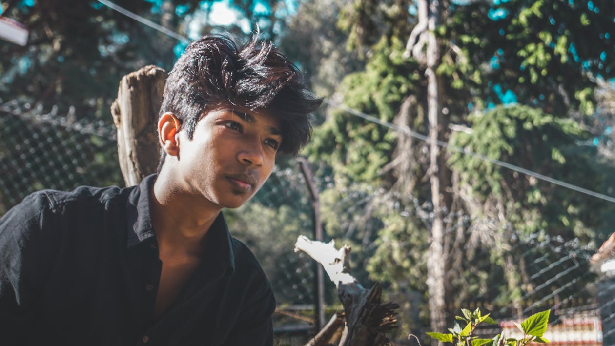 Man in Black Collared Shirt