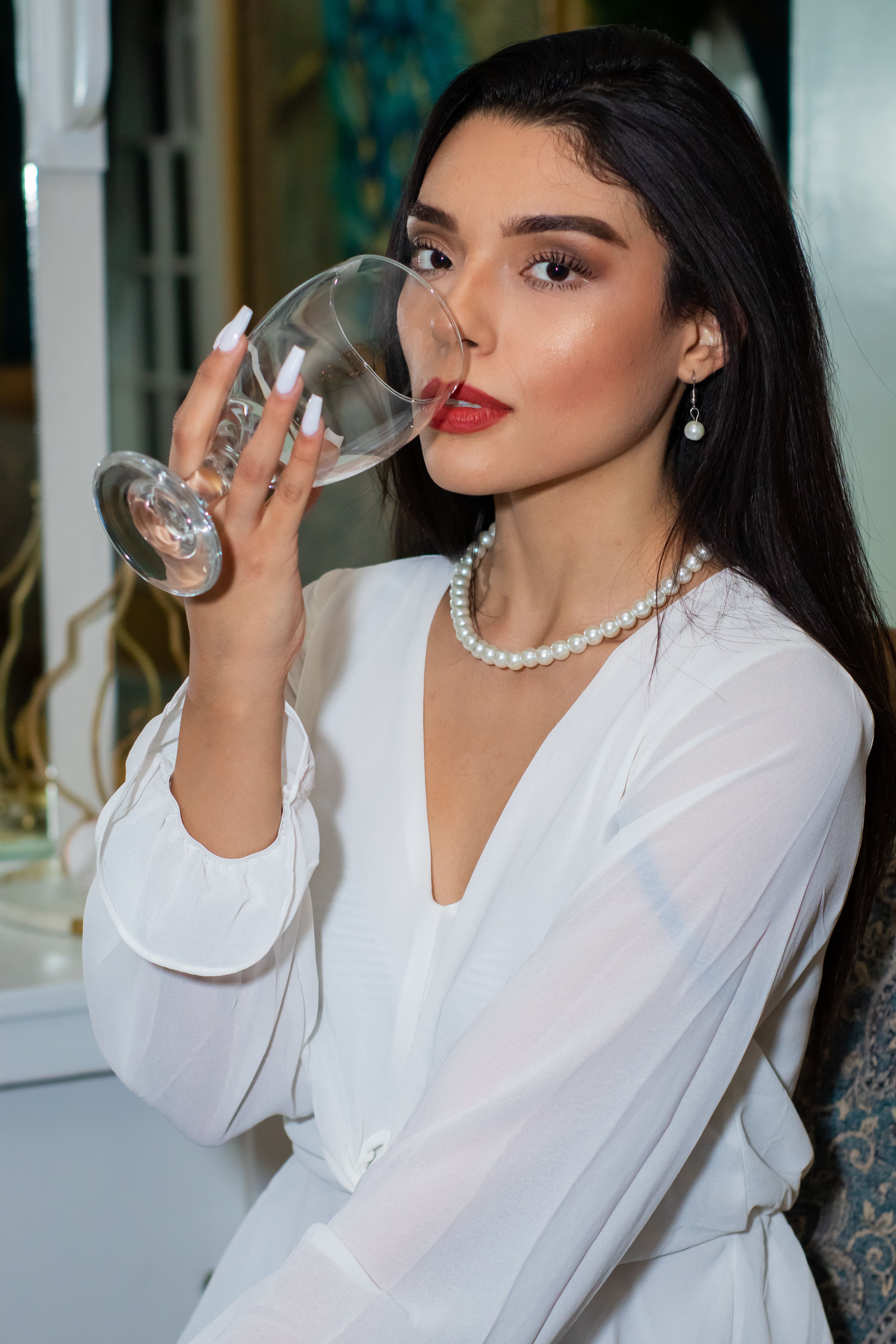 Women in White Long Sleeve Shirt Holding a Wine Glass · Free Stock Photo