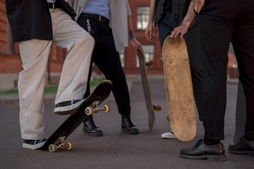 Skateboarders in Stylish Outfits
