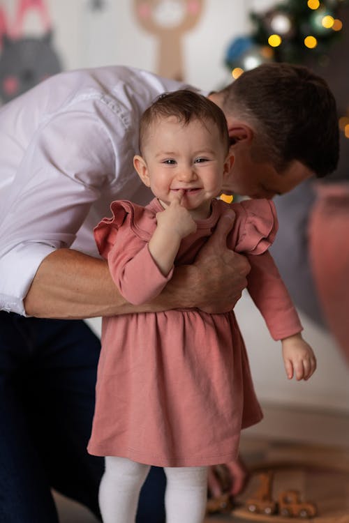 Free Man Holding a Toddler Stock Photo