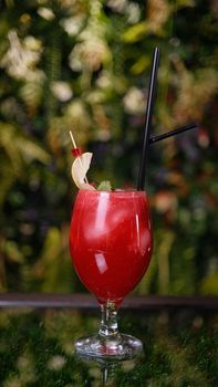 Red Liquid in Clear Drinking Glass With Straw