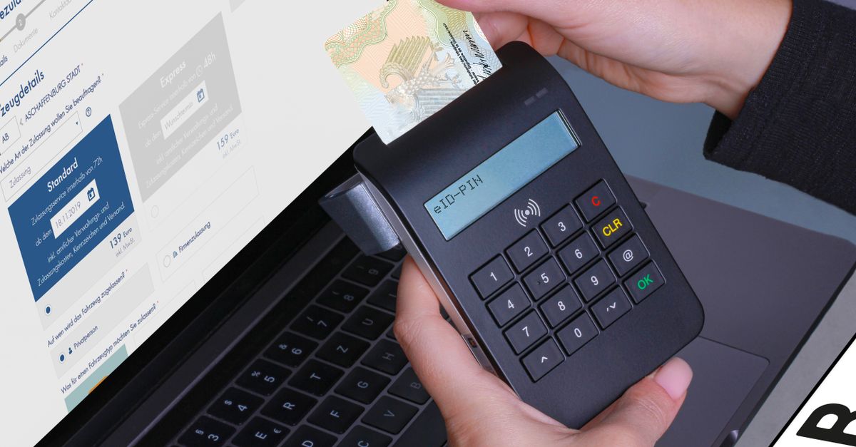 Close-up of a contactless payment using a card reader and laptop, highlighting digital security.