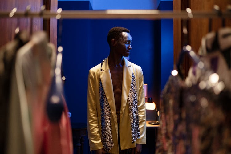 Male Fashion Model Wearing Yellow Jacket And Shining Scarf