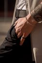 Man in Black Long Sleeve Shirt Wearing Silver Link Bracelet Watch