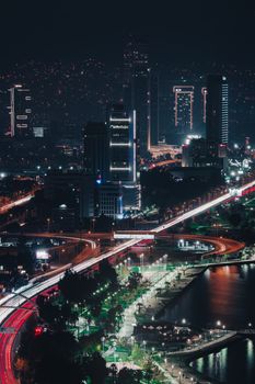 Stunning night view of İzmir's illuminated skyline and busy city life. Perfect for urban enthusiasts.