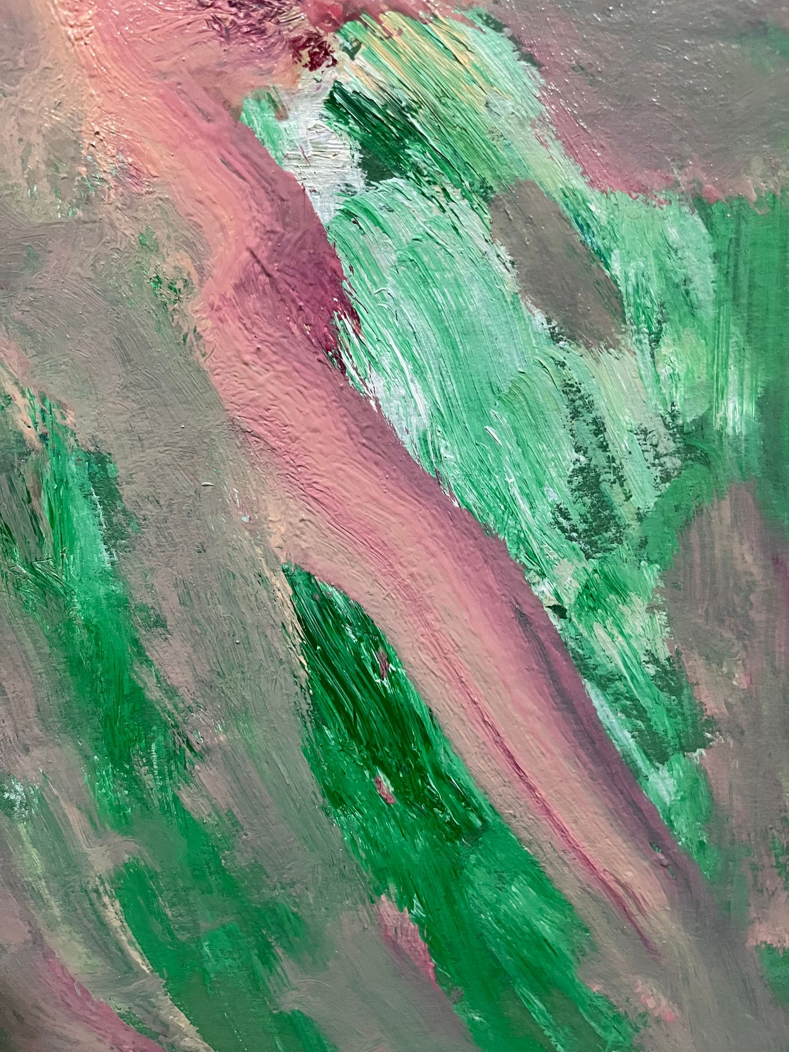 Green and rose brushwork in a close view of an abstract painting