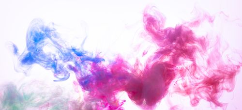 Free Colorful ink in water creating dynamic abstract patterns with vibrant colors and smooth textures. Stock Photo