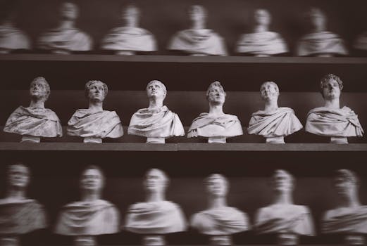 Black and white photo of Roman busts on display in a Florentine gallery.