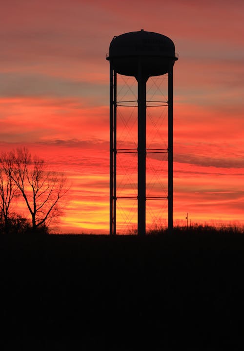 Silhouette of a Water Tank at Sunset