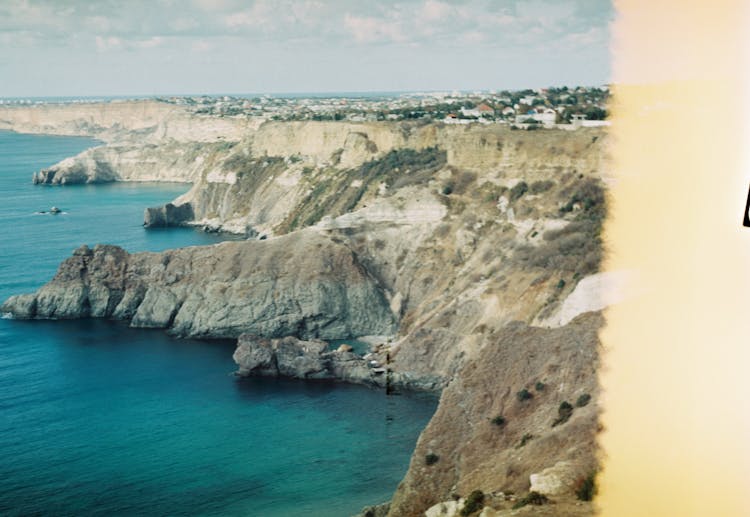 Stunning View Of Cliffs By Sea