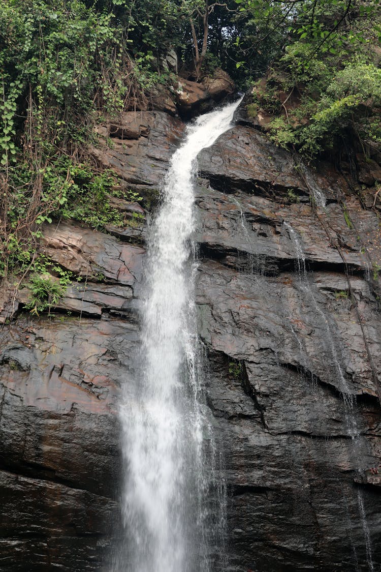 Waterfall On Rock Cliff