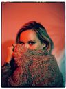 Woman Hiding her Face with Coat