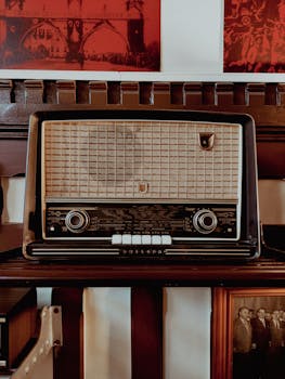 Close-up of a vintage retro radio with knobs and buttons, classic aesthetic.