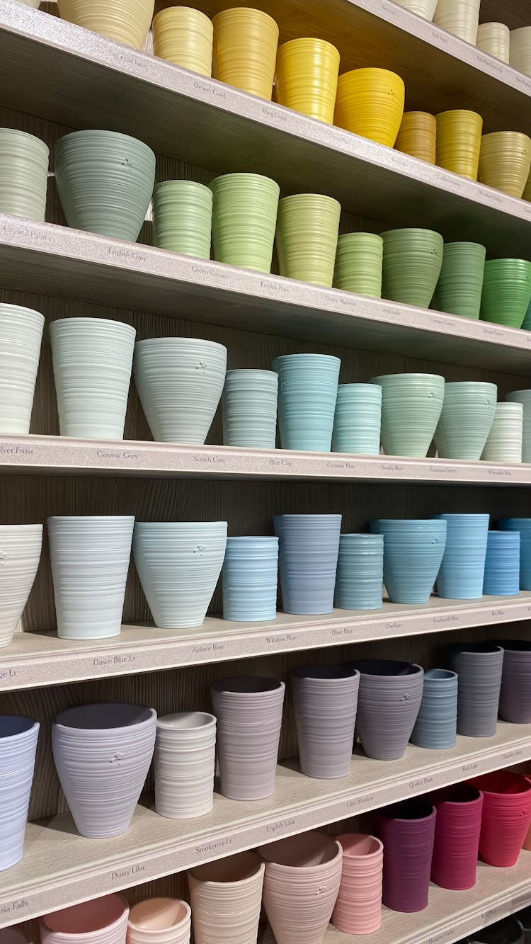 
Colorful Ceramic Pots On Shelves