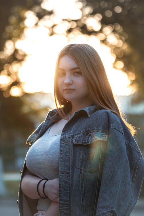 

A Woman Wearing a a Denim Jacket